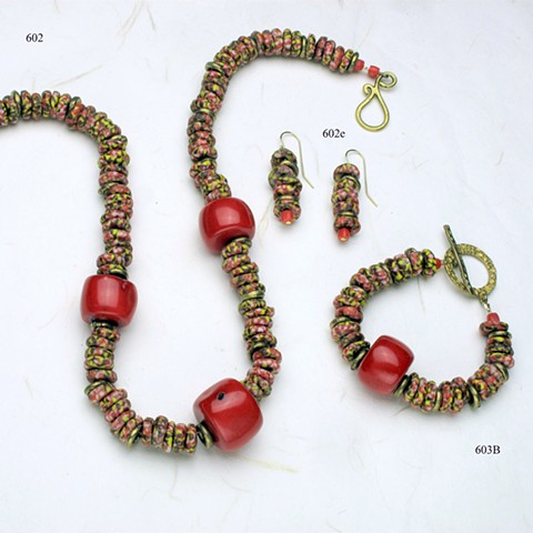 coordinating set of colorful glass beads from Benin, accented with large pieces of coral and Nigerian brass.  The necklace (#602) is finished with a brass clasp; (#602e) are on g/f wires. (sorry, the bracelet has been sold)