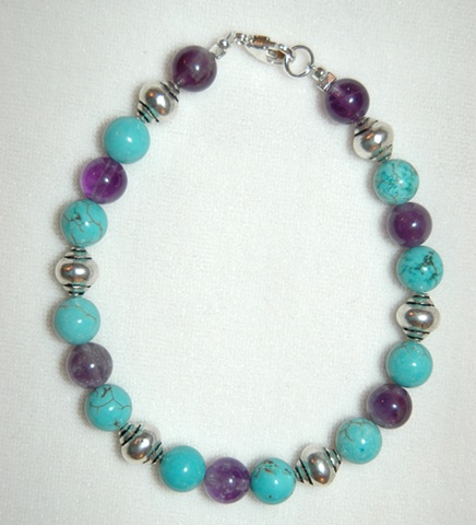Blue chalk Turquoise and Amethyst bead bracelet accented with incised silvertone beads with Sterling silver clasp