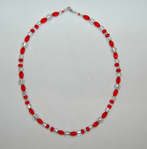 Necklace of Sparkling Silver colored Murano style Glass beads, round-shaped with ruby red faceted crystal beads