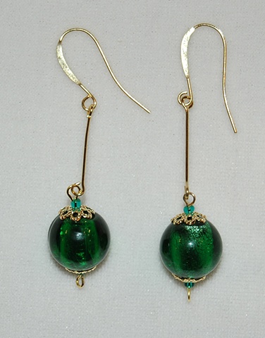 Emerald green murano style glass Earrings with filigreed bead caps on long gold eye wire