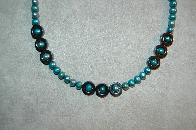Hematite and aqua-green Freshwater Pearl Necklace with Sterling Silver clasp.