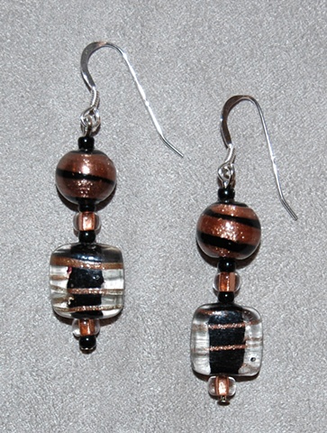 Black and clear glass Earrings  with swirls of copper color  accented with black glass seeds beads