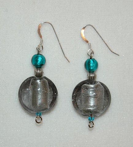 Grey foil-lined Murano style glass, puff coin shape, accented with aqua Murano style glass and silver tone bead 
