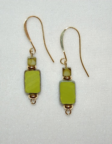 Earrings of Picasso-style Czech glass beads in lime green