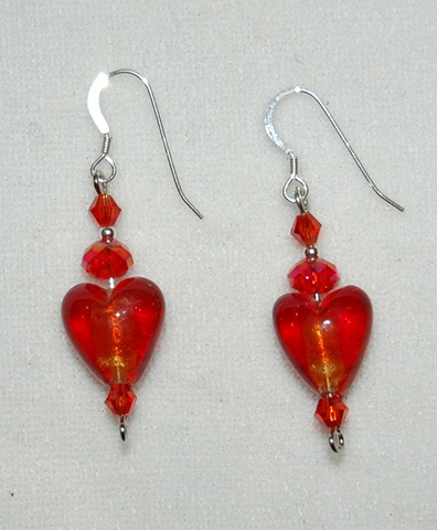 Heart shaped red murano style glass earrings with crystal bead accents.