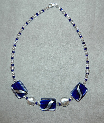 Rectangular Murano style glass bead Necklace in vibrant hues of cobalt blue and silver with black swirl accented with silver glass puff coin-shaped beads 