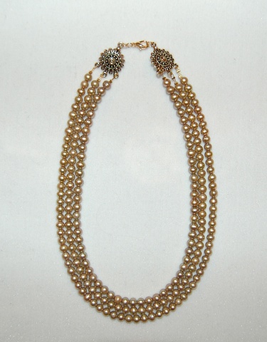 Triple stand of sand-colored Freshwater pearls 