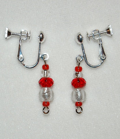 Earrings of Sparkling Silver colored Murano style Glass beads, round-shaped,with ruby red faceted  rondell-shaped crystal beads 
