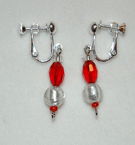 Earrings of Sparkling Silver colored Murano style Glass beads, round-shaped,with ruby red faceted  crystal beads