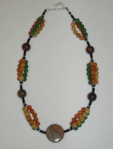 Triple strand necklace of Carnelian, Green Advenurine and Yellow Jade interspersed with Tiger Iron Jasper