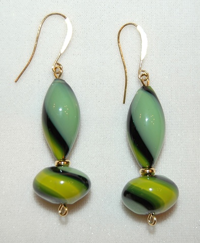 Blown Glass Earrings in swirls of green, yellow and black, in elongated rounded tube shape and oval shape 