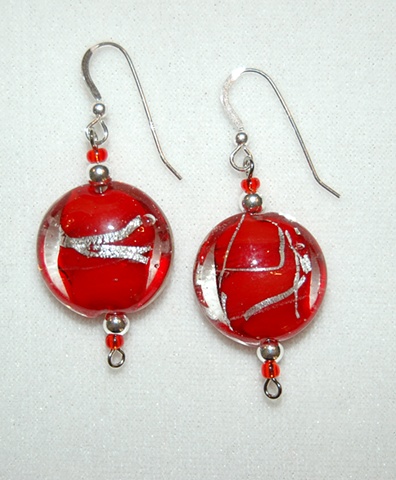 Murano style glass beads, ruby red interior with silver line, puff coin shape accented with silver beads 