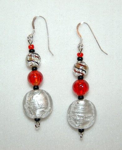 Silver Murano style glass, puff coin shape Earrings accented with beads of red Murano style glass and silver glass with red and back swirl 