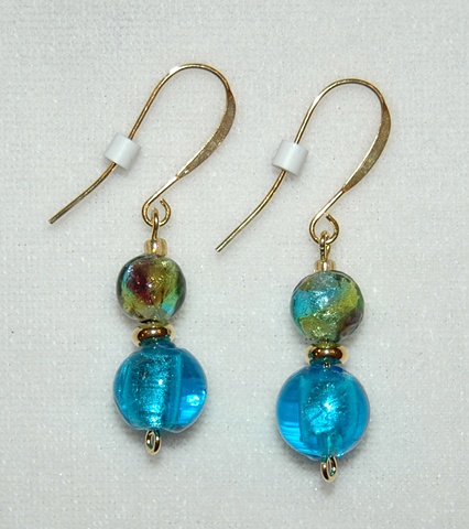 Murano style glass featuring a round aqua bead with purple/green/aqua mix glass bead 