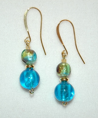 Aqua foil lined glass bead, round in shape, accented with murano style glass bead in soft mix of aqua/green/purple and gold plated heishi spacer 