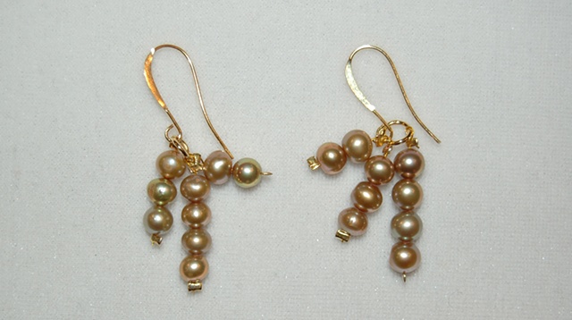 Triple extensions of sand-colored Freshwater pearls on elegant elongated 22K gold over hypoallergenic French ear wires
