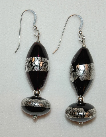 Blown Glass Earrings in Black with silver leaf, in elongated rounded tube shape and oval shape with Sterling silver spacers 