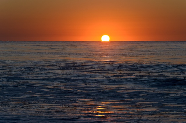Sun rising over ocean at Cape May beach, October 2011