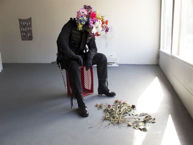 Kathryn Andrews
Requiem and Reverb
2010
Flowers and borrowed artwork (Scott Benzel, The Flowering of Instrumental Reason, 2007, mixed media)
