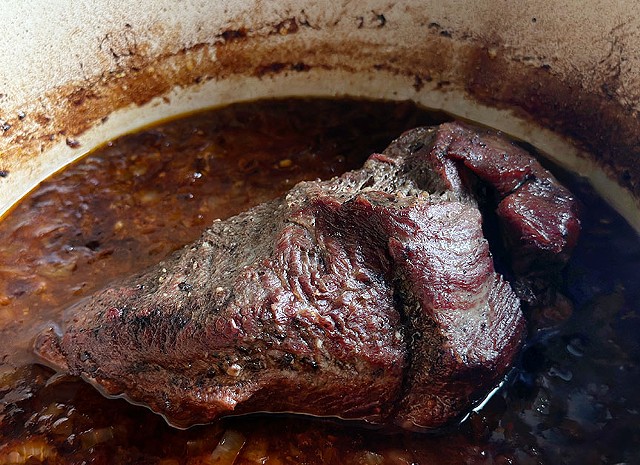 Beef stewing in a pot. Food photography by Margaret Waage Photography