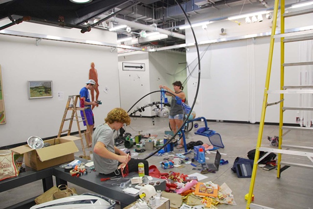 sculpture students building installation