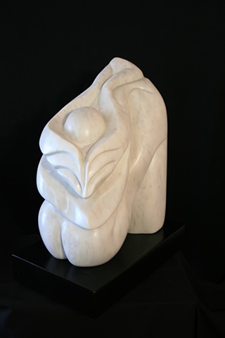 This is a modern contemporary stone sculpture of  morphing of human and plant forms by Denis A. Yanashot