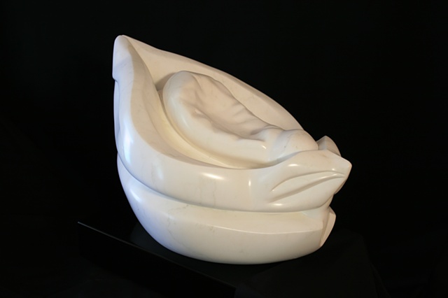 This is a modern contemporary stone sculpture of an imaginary interpretation of a dried-out seed pod  by Denis A. Yanashot