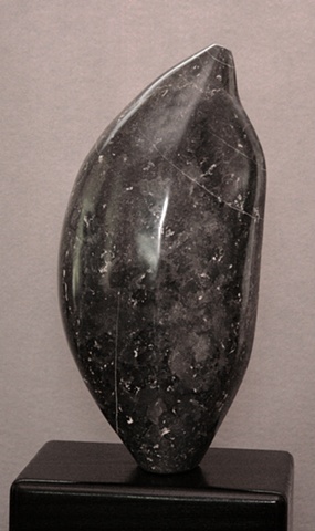 This is a comtemporary stone sculpture of a very healthy and well-nourished seed by Denis A. Yanashot.