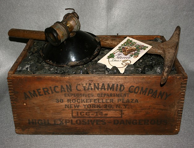 Anthracite monkey vein coal miner's Christmas gift of coal, pick and carbide light in explosive box. 