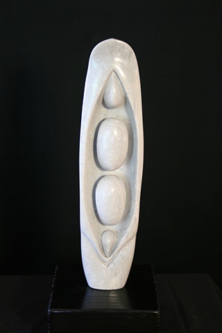This is a modern contemporary stone sculpture of a Peapod by Denis A. Yanashot
