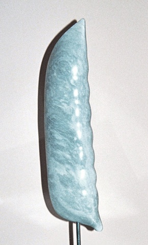 This is a modern contemporary stone sculpture of a pure up-scaled representation of a snap pea by Denis A. Yanashot