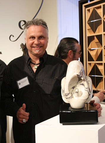 Denis A.Yanashot with his sculpture entitled "Catasetum".