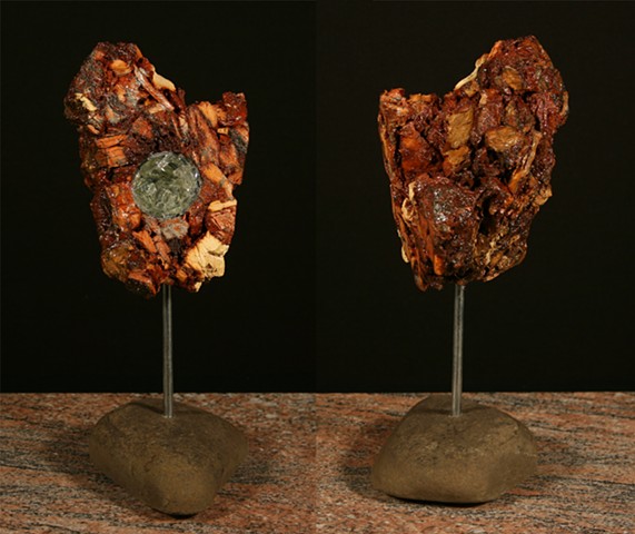 This mixed media sculpture of the “geode series” consists of a carved anthracite burnt culm mass, polyurethane, polycarbonate plastic, industrial adhesive and glass shards to create a geode-like form.
