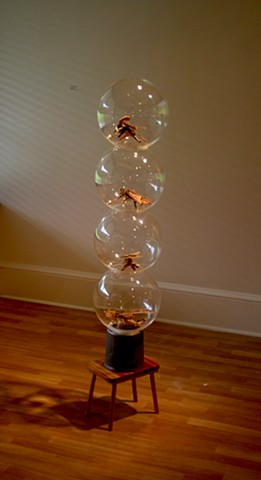 wood sculpture with paint and acrylic spheres