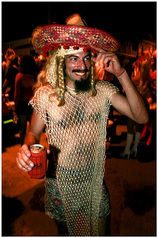6- Jorge Lopez poses for a portrait in his “meshican” costume at Mid-Summer Mardi Gras.