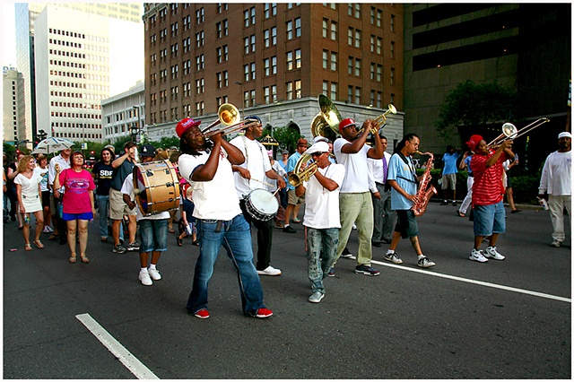 Members of Rebirth Brass Band lead a second line through New Orleans on the 6th Anniversary of Katrina ending with the unveiling of a memorial at the Sartatoga Building.