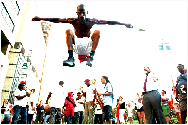 Darryl Young A.K.A. “Dancing Man”  Jumps or as he calls it “pogos”  during the Katrina second line and memorial unveiling. 