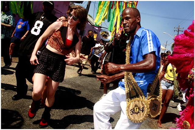 Elsie Semmes and Darryl Young dance down Rampart Street during a second line celebrating and honoring the grand opening of The New Orleans Healing Center. The second line traveled down Rampart to the New Orleans Healing Center with their arrival kicking o