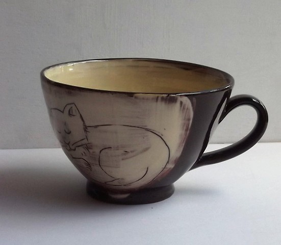 Tea cup with cat and dog