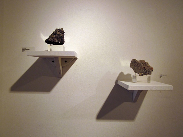 2 pavement specimens at the"Moving Ground" show at the Ann Arbor Art Center, January 2011