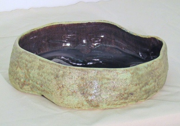 Large shallow vessel with crater glaze