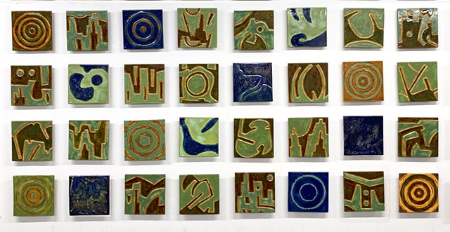 32 8"x8" ceramic tiles mural, in verigrated greens, dark blues, and deep amber glazes 