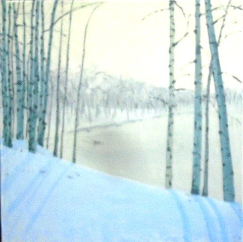 Birches in winter with lake in the distance