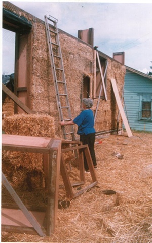 Community involvement in raising straw bale walls 