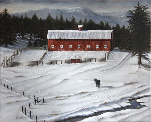 A black horse and a red barn on an icy Montana winter day.