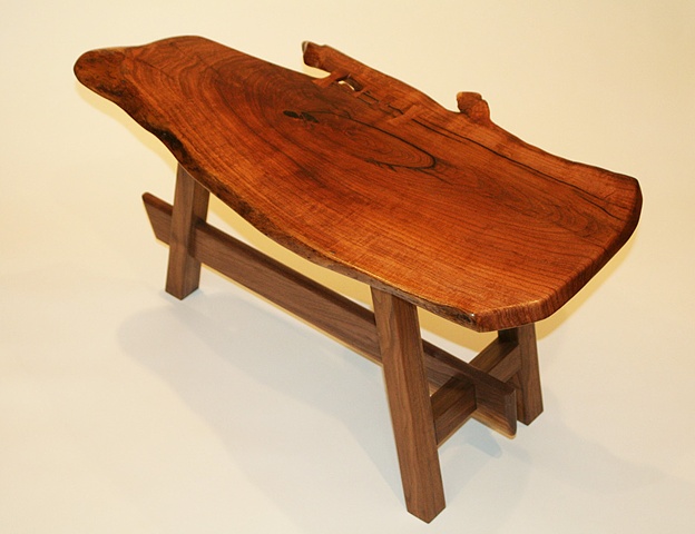 Contemporary end table--free edge mesquite top with butterfly inlays, black walnut base.