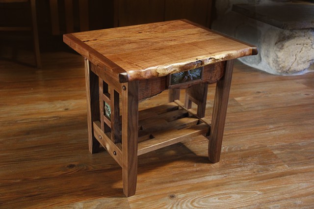 Small specialty table with natural edge Mesquite top and front, and Black Walnut base.