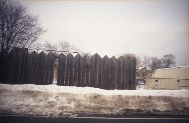 color photography of fence and snow in winter by iris grimm