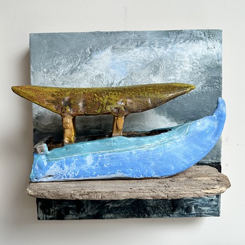 Blue Boat on Wooden Shelf