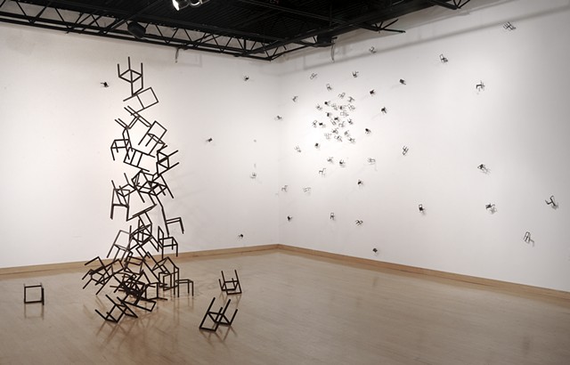 welded steel chairs depicting the relationship between Cassiopeia and her daughter Andromeda in sculpture and installation. woman welding welds, steel. 